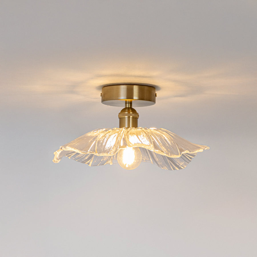 Modern gold metal ceiling light with artistic wire glass shade for luxury interior decor and ambient lighting spaces.