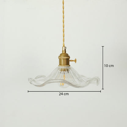 A clear ribbed glass pendant light with a brass fitting and gold-toned cord, shown against a light gray background with dimension markers indicating 24 cm width and 10 cm height.