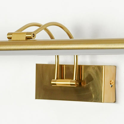 Gold metal picture light with refined mounting detail showcasing premium craftsmanship and contemporary design appeal.