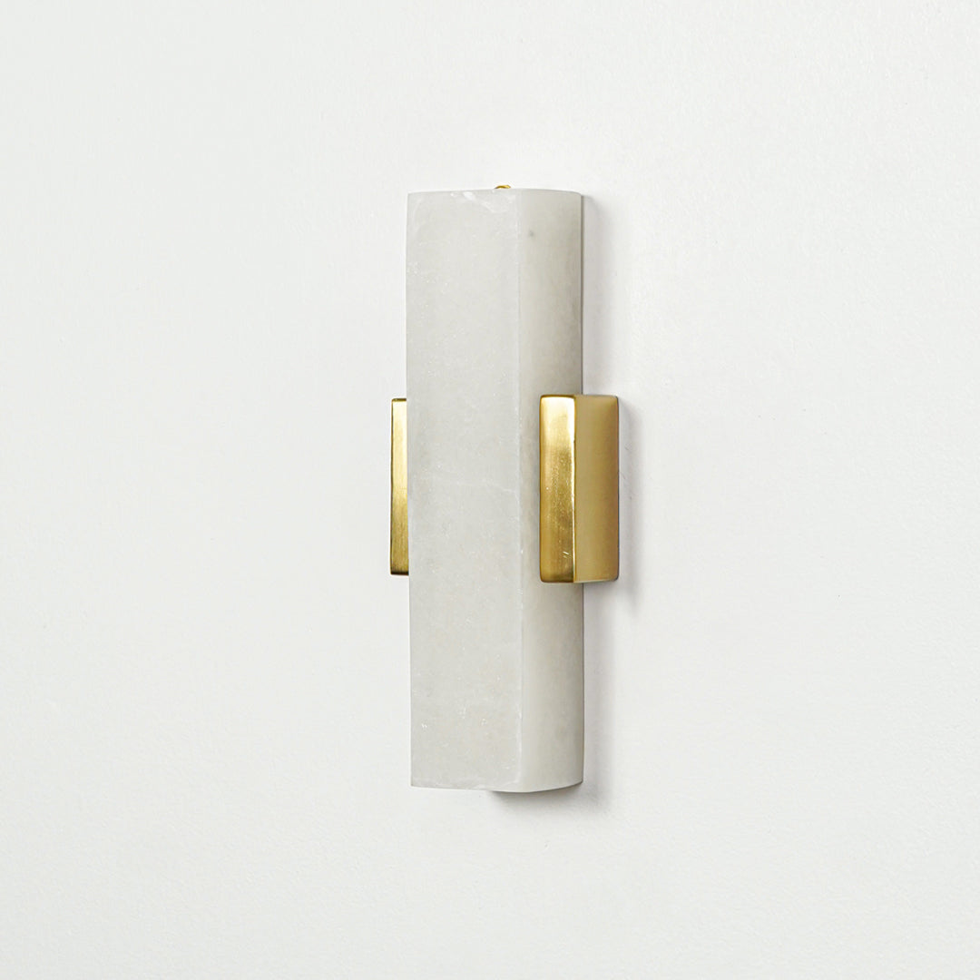 Gold wall light with vertical frosted glass tube mounted on neutral wall background ideal for modern bedroom or hallway lighting.