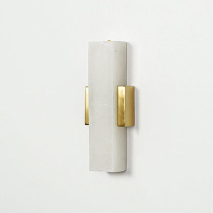 Gold wall light with vertical frosted glass tube mounted on neutral wall background ideal for modern bedroom or hallway lighting.