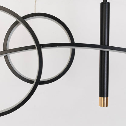 Closeup of pendant light with golden glow circular rings and slim black frame for stylish ceiling lighting design.