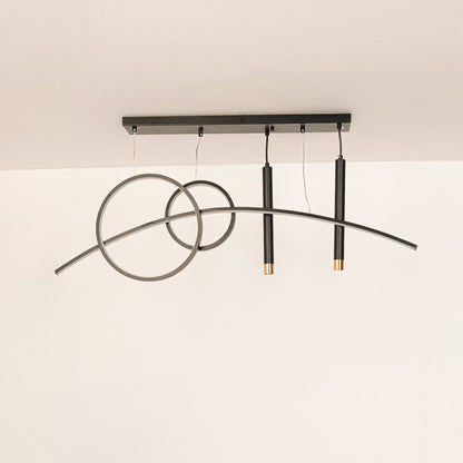 Pendant light with circular rings and black hanging rods in off mode displayed on white background for decor showcase.
