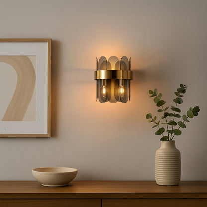A modern metal and smoked glass wall light glowing warmly in a stylish living room setting ideal for hallway or bedroom ambient lighting.