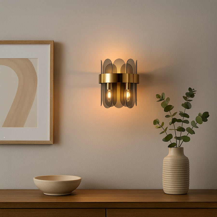 A modern metal and smoked glass wall light glowing warmly in a stylish living room setting ideal for hallway or bedroom ambient lighting.