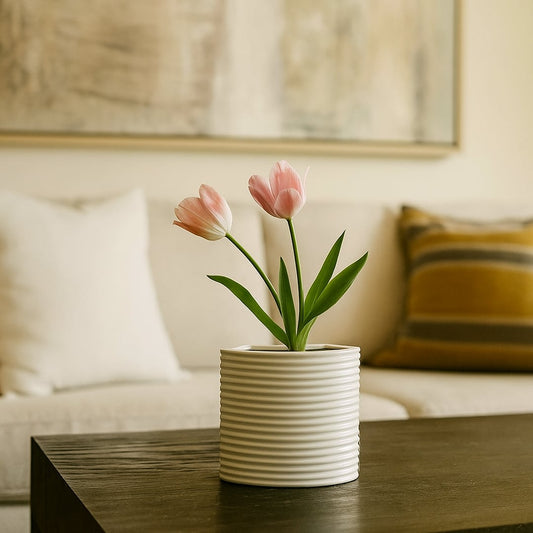 White ribbed ceramic planter styled in a modern home setting ideal for consoles shelves and elegant contemporary interior decor.