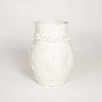 Classic white ceramic flower vase with ornamental texture perfect for entryway table living room or dining decor display.