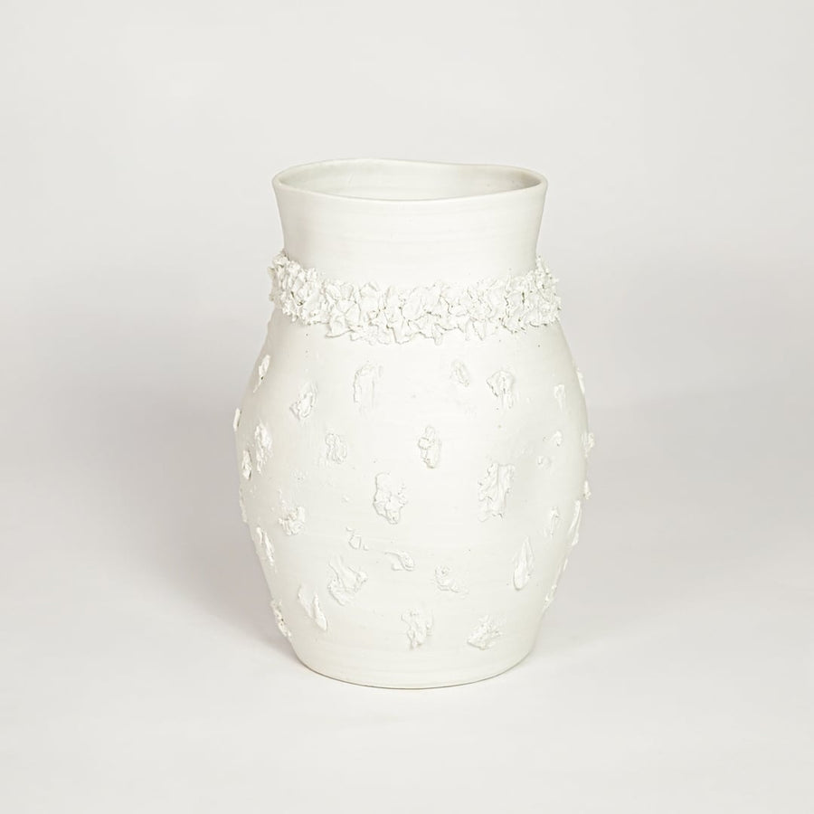 Classic white ceramic flower vase with ornamental texture perfect for entryway table living room or dining decor display.