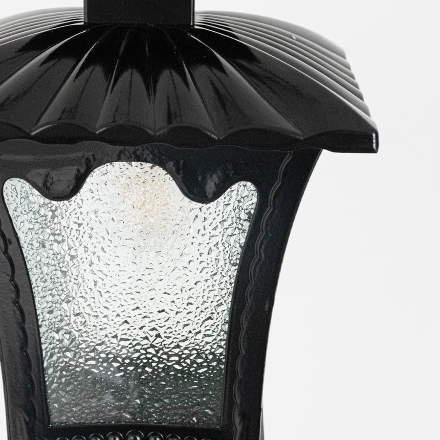 Classic hanging lantern light enhancing patio or entryway decor with a warm inviting glow and graceful design.