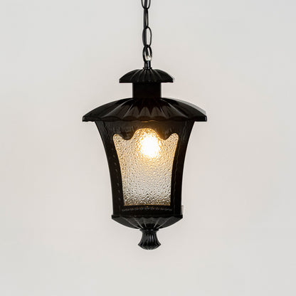 Vintage black metal hanging lantern light with warm glow and textured glass for elegant porch decor.