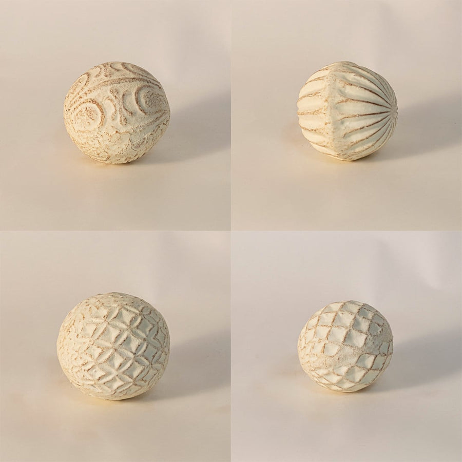 Close-up of textured ceramic ball highlighting detailed craftsmanship and soft natural clay texture.