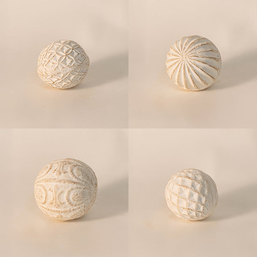 Close-up of decorative carved ball revealing intricate hand-carved detailing and fine textured ceramic finish.