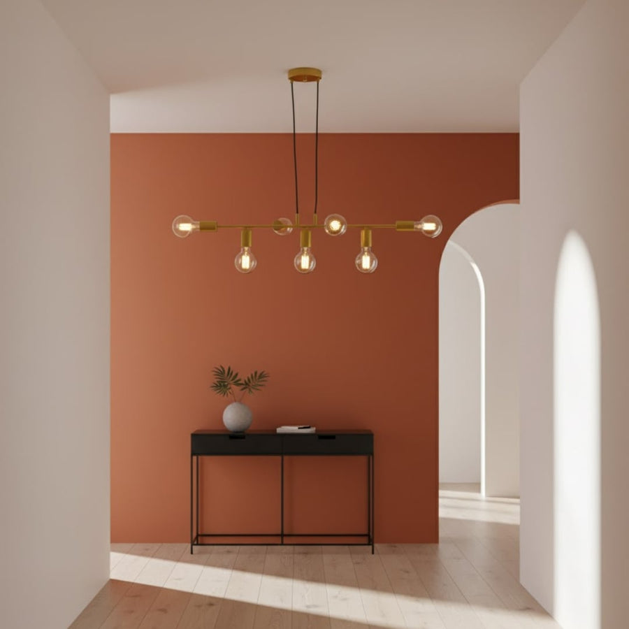Modern chandelier with metal arms and warm globe lights hanging in hallway adding artistic ambient lighting to contemporary interior decor.