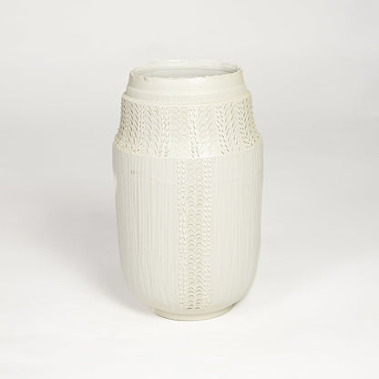 White ceramic textured vase with detailed handcrafted pattern isolated on clean white background for contemporary home decor use.