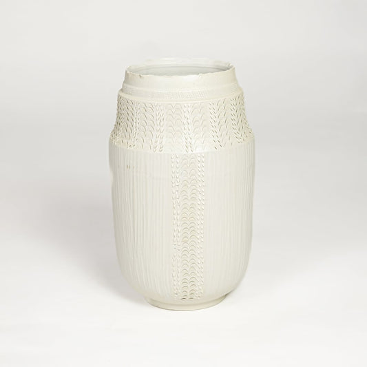 White ceramic textured vase with detailed handcrafted pattern isolated on clean white background for contemporary home decor use.