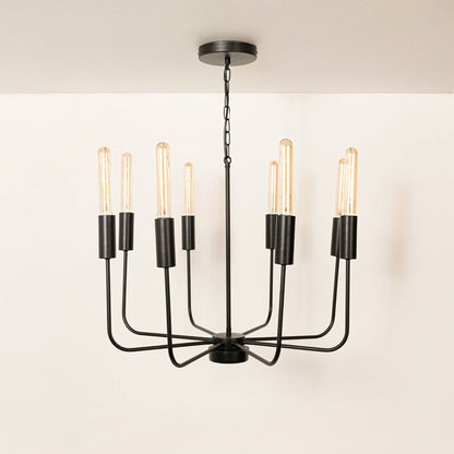 Contemporary black metal eight arm chandelier with chain and Edison tube bulb sockets turned off displayed on white background.