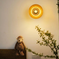 Modern round warm glass wall sconce light for kids bedroom bedside nursery corner decoration contemporary home interior.