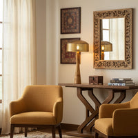 Artistic table lamp combining natural wood and golden metal creating an eye-catching accent piece ideal for modern home decor styling.
