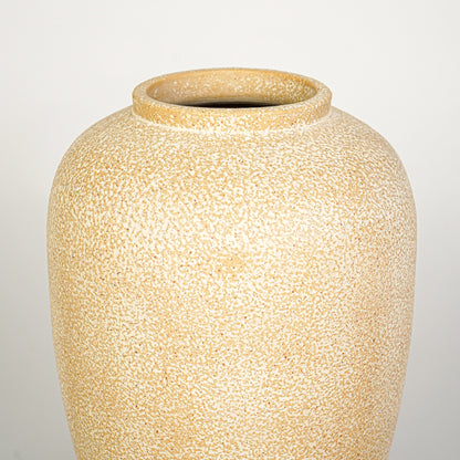 Closeup image of beige ceramic decorative vase for modern interior decor styling with textured matte finish.
