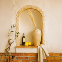 Lifestyle image of beige ceramic floor vase for modern living room decor styling with elegant rustic finish.