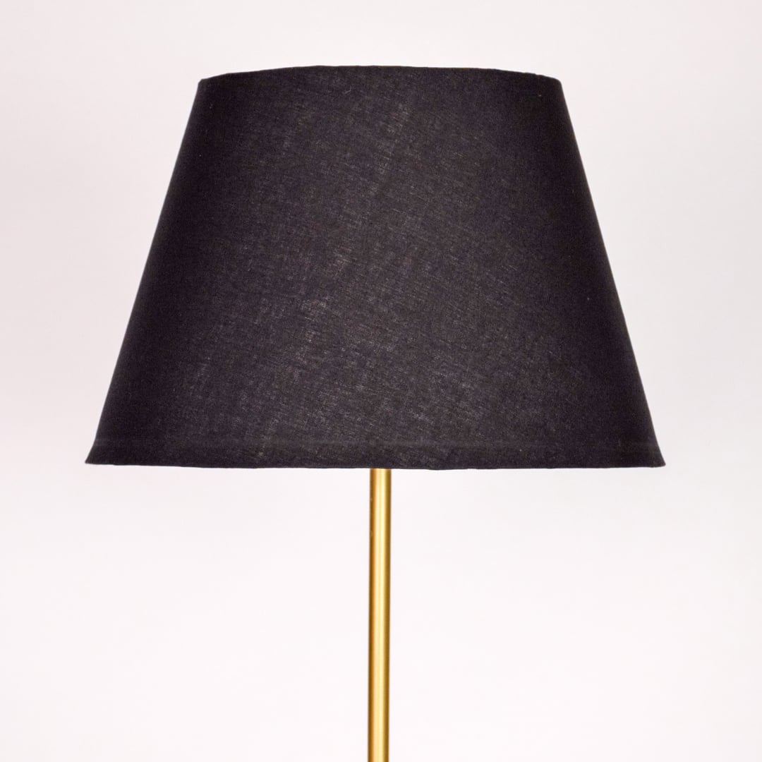 Closeup black fabric tapered shade with smooth texture for soft diffused lighting in modern interior spaces Decor.