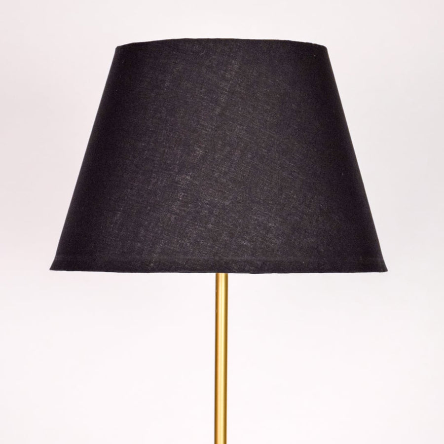 Closeup black fabric tapered shade with smooth texture for soft diffused lighting in modern interior spaces Decor.