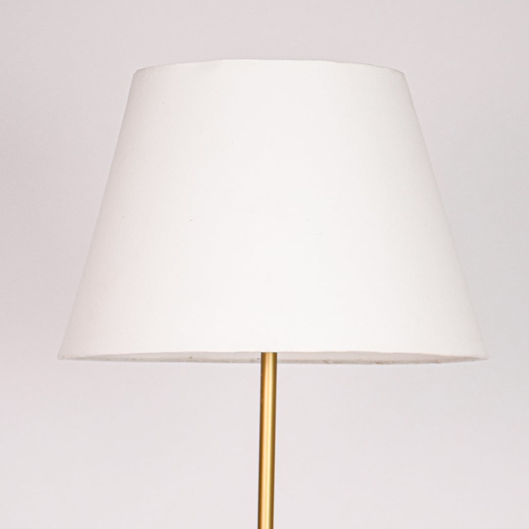 Wide tapered white fabric lampshade with smooth finish and soft curves designed for warm ambient lighting.