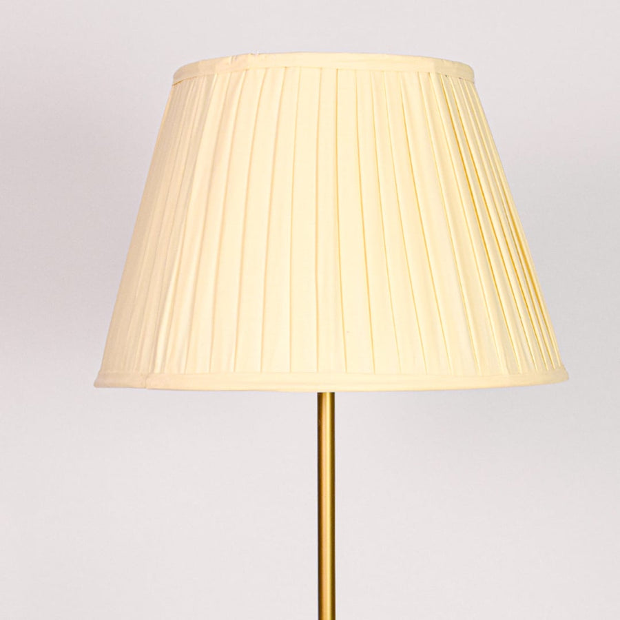 Closeup pleated cream fabric shade with textured detailing for soft diffused lighting in elegant interior spaces Decor.