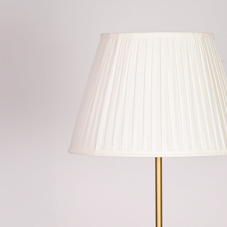 Closeup pleated white fabric shade with textured detailing for soft diffused lighting in elegant interior spaces Decor.