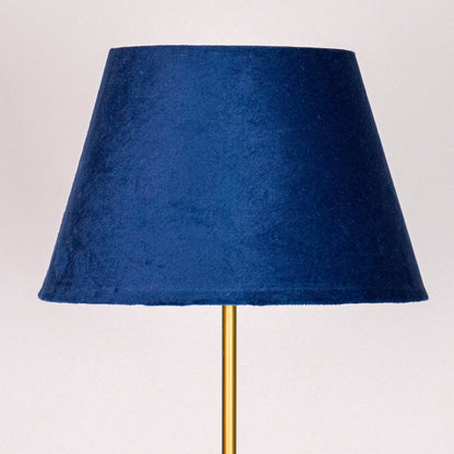 Closeup blue fabric tapered shade with smooth finish crafted for soft diffused lighting in contemporary home Decor.