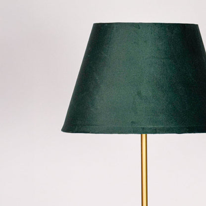 Closeup green fabric tapered shade with smooth texture designed for soft ambient lighting in modern living room Decor.