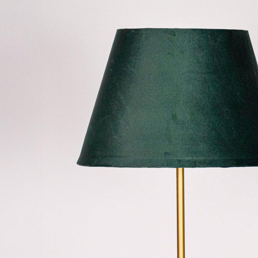 Closeup green fabric tapered shade with smooth texture designed for soft ambient lighting in modern living room Decor.