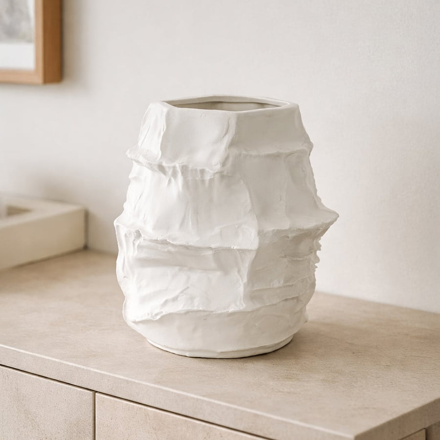White ceramic flower vase placed on wooden console modern decorative vase for living room shelf table home decor styling.