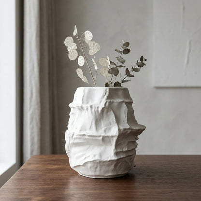 White ceramic decorative flower vase placed on wooden table modern vase for living room shelf console home decor styling.