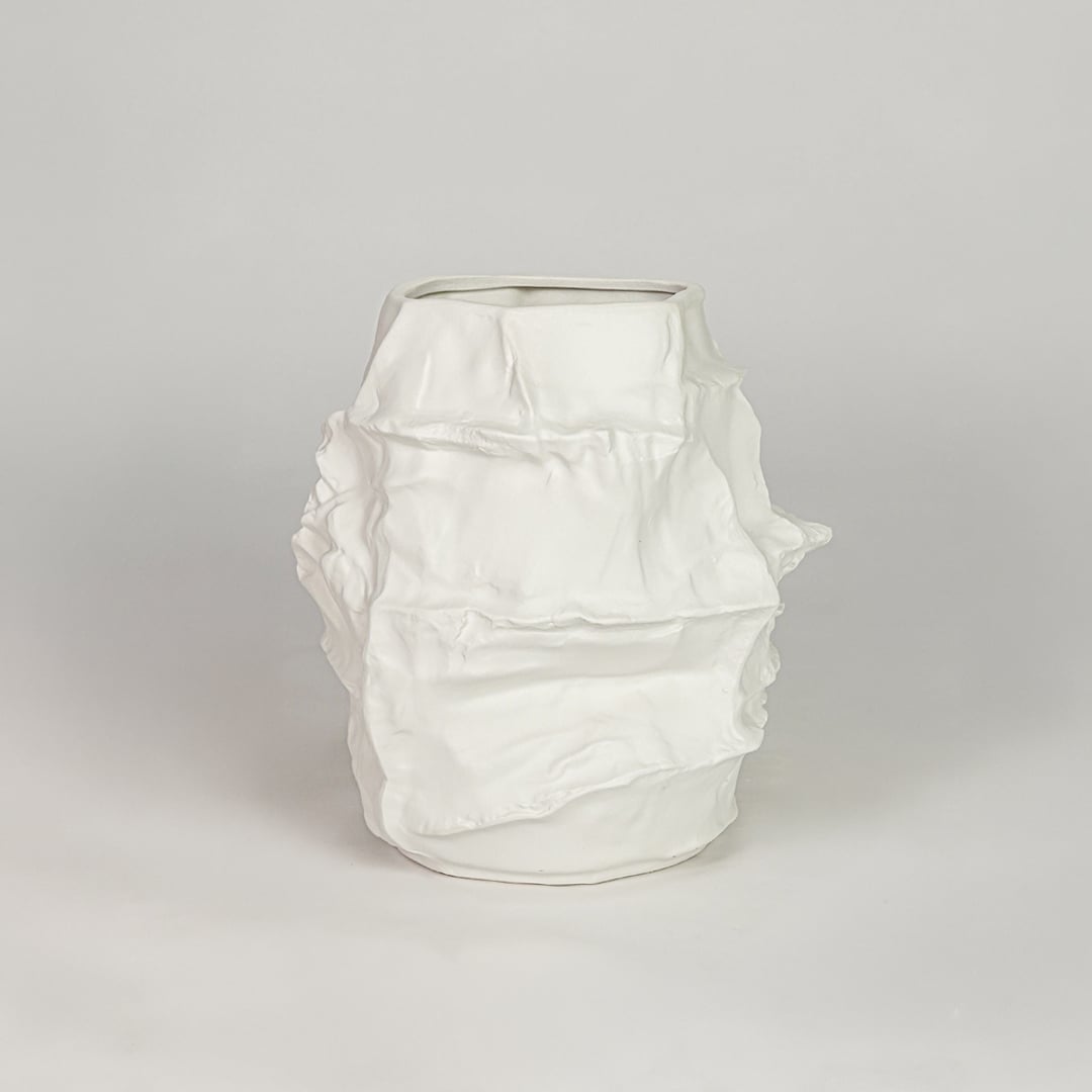 White ceramic decorative flower vase with textured finish modern vase for tabletop shelf console living room decor styling.