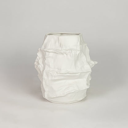 White ceramic decorative flower vase with textured finish modern vase for tabletop shelf console living room decor styling.