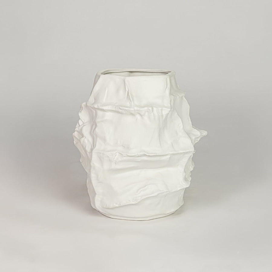 White ceramic decorative flower vase with textured finish modern vase for tabletop shelf console living room decor styling.
