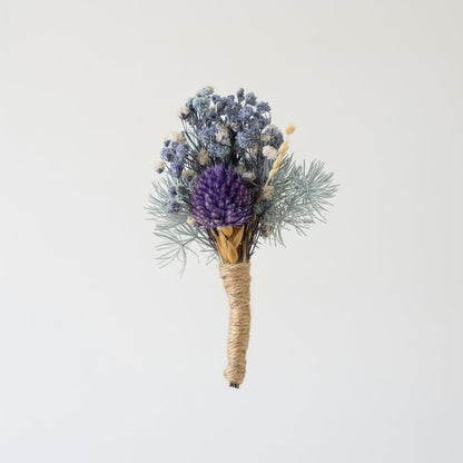 Decorative dried flower bouquet with mixed blue purple tones wrapped in natural twine perfect for table shelf styling.