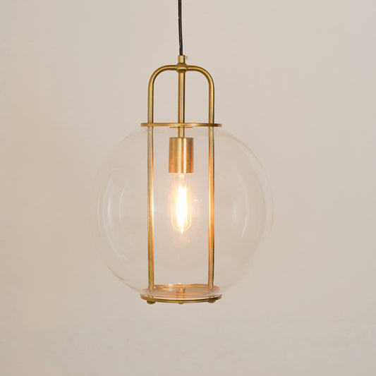 White background image of illuminated korean inspired globe glass hanging pendant lamp for elegant dining room decor styling and modern home lighting.