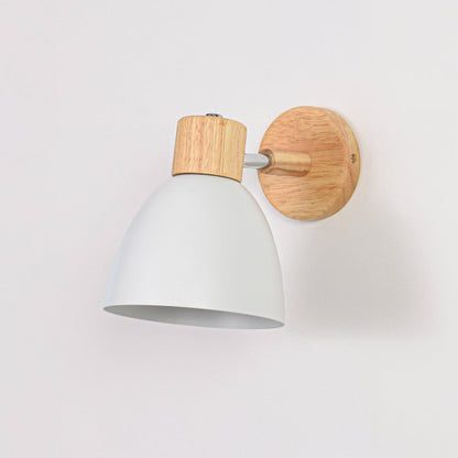 White metal wall light with wooden base switched off on white background showing smooth finish compact form and clean styling.