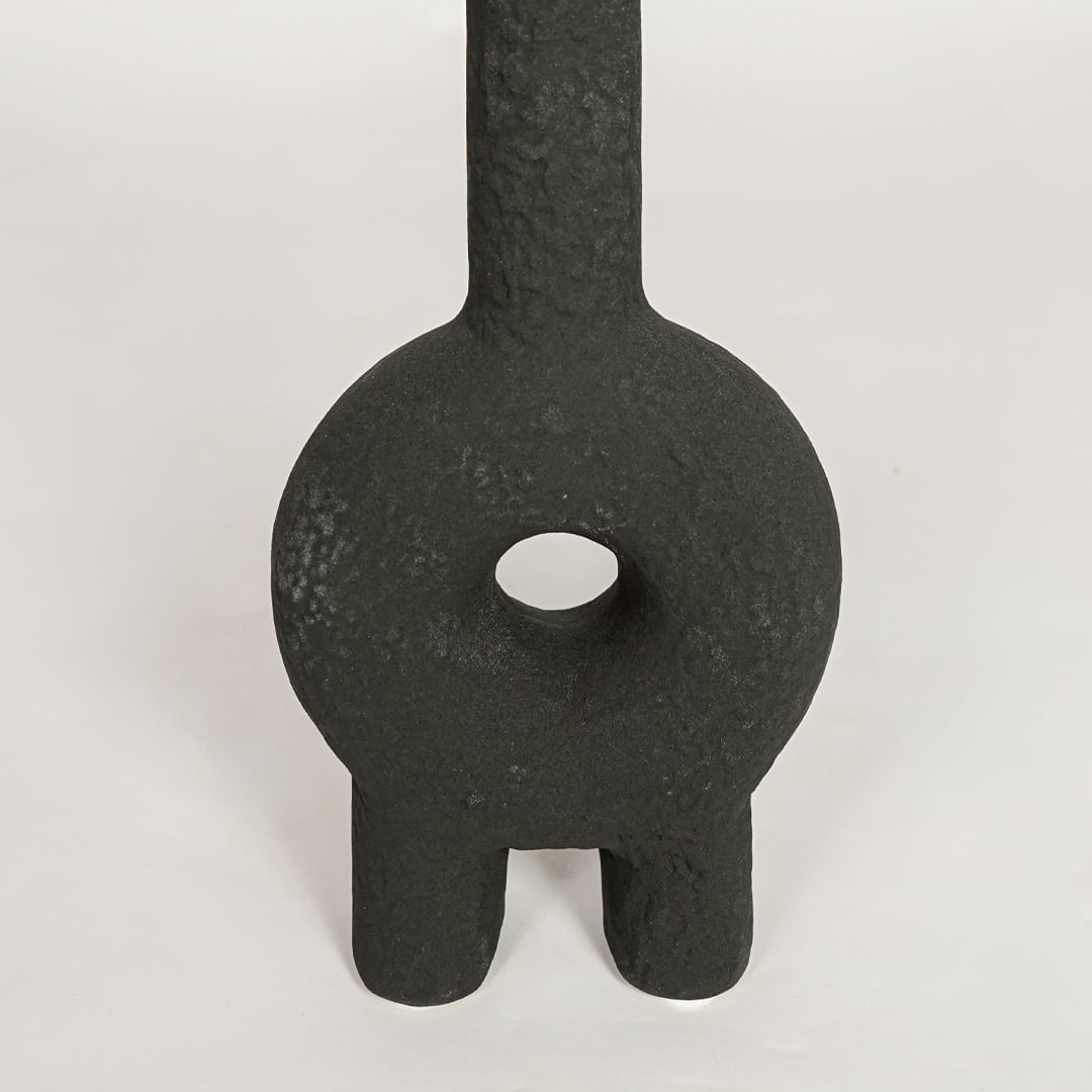 Black ceramic sculptural decorative vase with textured finish perfect for artistic dried floral display and contemporary interior decor.