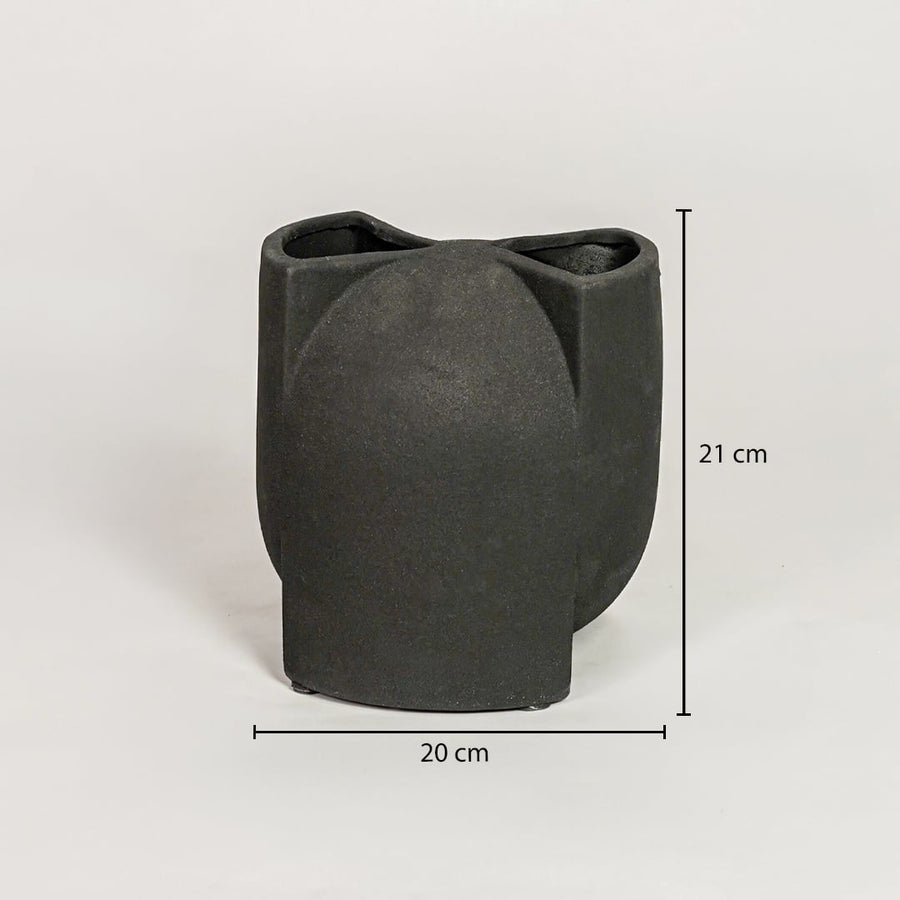Black ceramic abstract sculpted vase measuring 21 cm height and 20 cm width perfect for contemporary home decor placement.