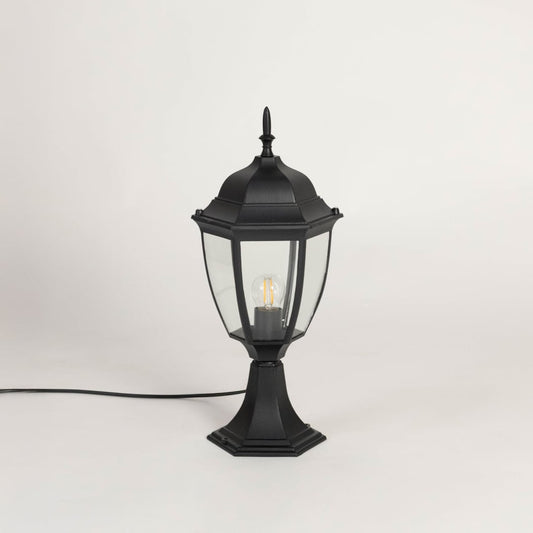 Classic black outdoor pillar lamp with clear glass panels ideal for modern garden patio balcony and driveway lighting.