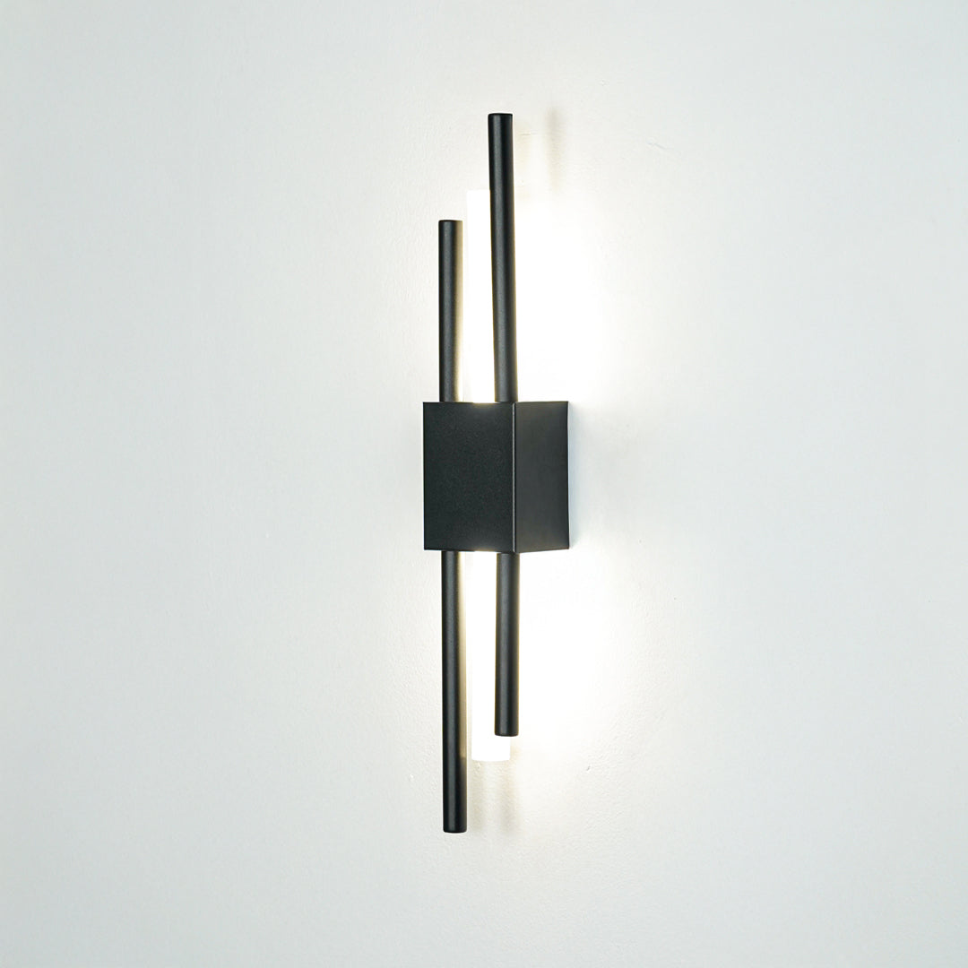 Contemporary black metal wall light with dual linear rods mounted on white background for modern interior lighting decor.