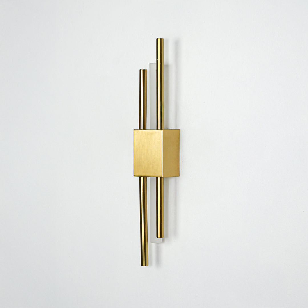 Modern gold metal wall light mounted on white background for elegant bedroom hallway and living room decor styling.