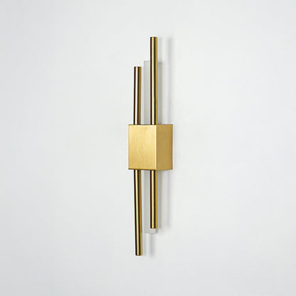 Modern gold metal wall light mounted on white background for elegant bedroom hallway and living room decor styling.