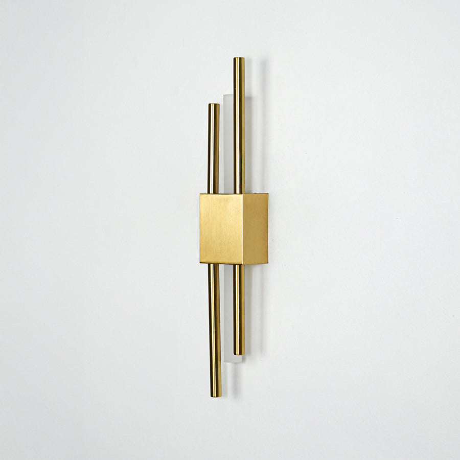 Modern gold metal wall light mounted on white background for elegant bedroom hallway and living room decor styling.