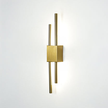 Elegant gold metal wall light glowing on white wall for modern bedroom hallway and luxury interior decor styling.