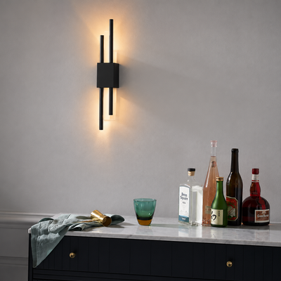 Lifestyle image of lasha black metal wall lamp for elegant hallway decor styling and modern home interior illumination.