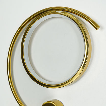 Beautiful warm illuminated gold metal led ring wall light for modern bedroom decor styling and luxury home lighting design